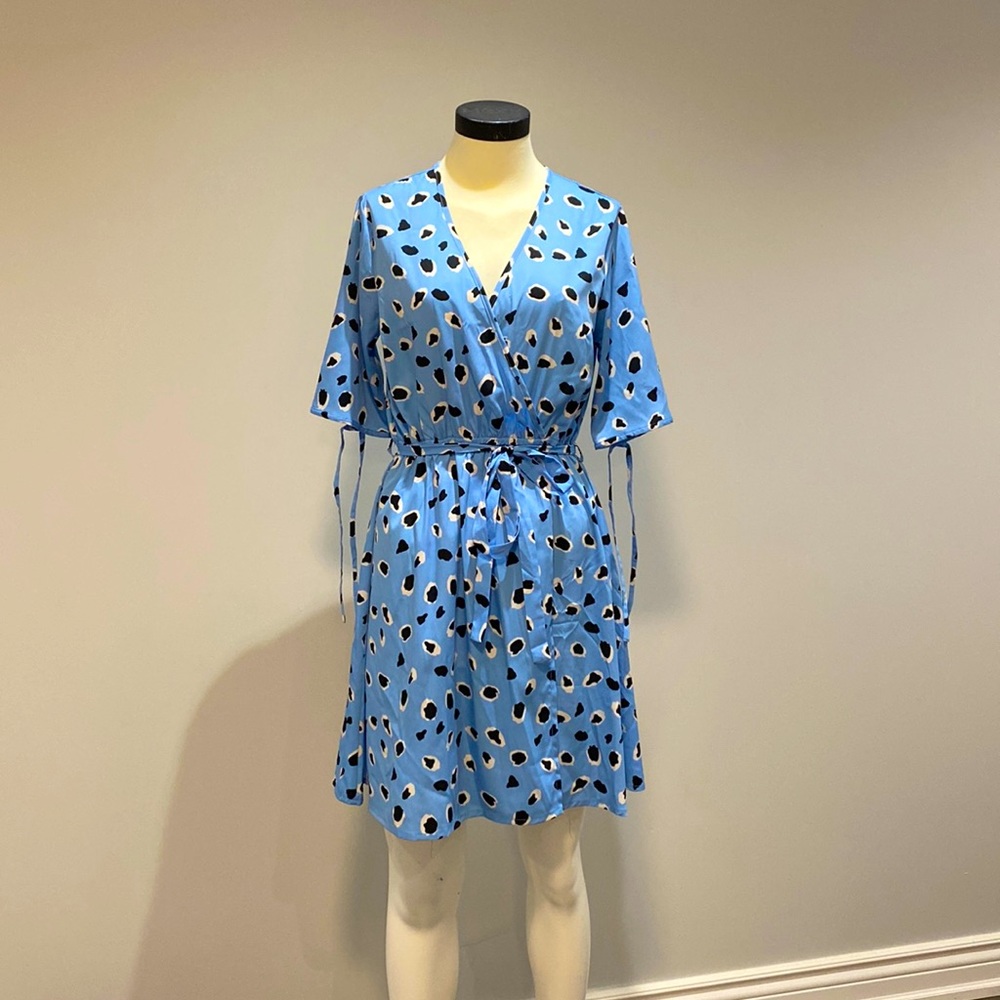 Blue wrap dress with black and white details